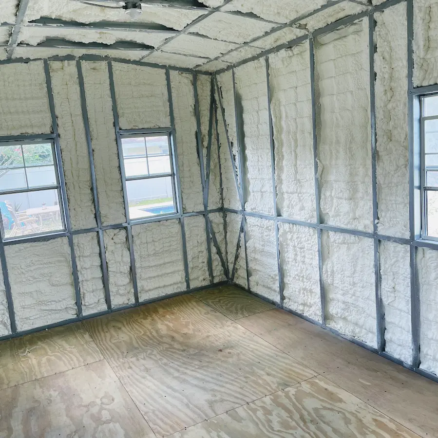 Closed-cell spray foam insulation applied to wall cavities in a residential project in Liberty