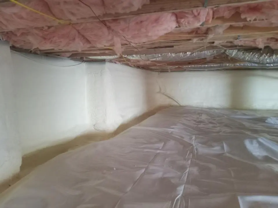 Crawl space encapsulation with closed-cell spray foam for Commercial Roof Restoration in Liberty